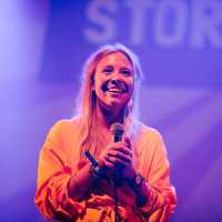 Image of a StorySlam storyteller on stage